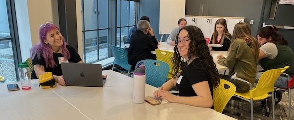 Sabrina and Sara discussing research