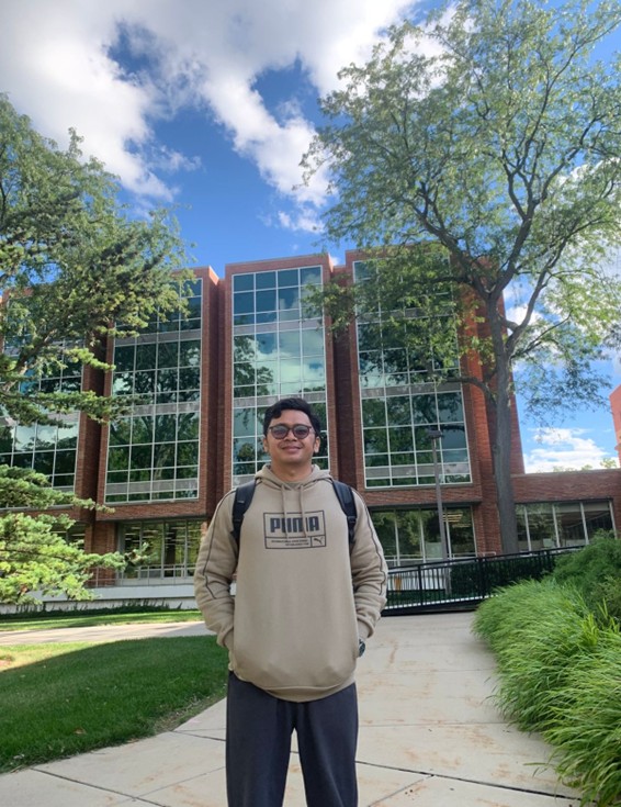 Andre in front of MSU Library