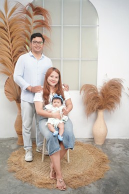 Andre with wife and baby daughter