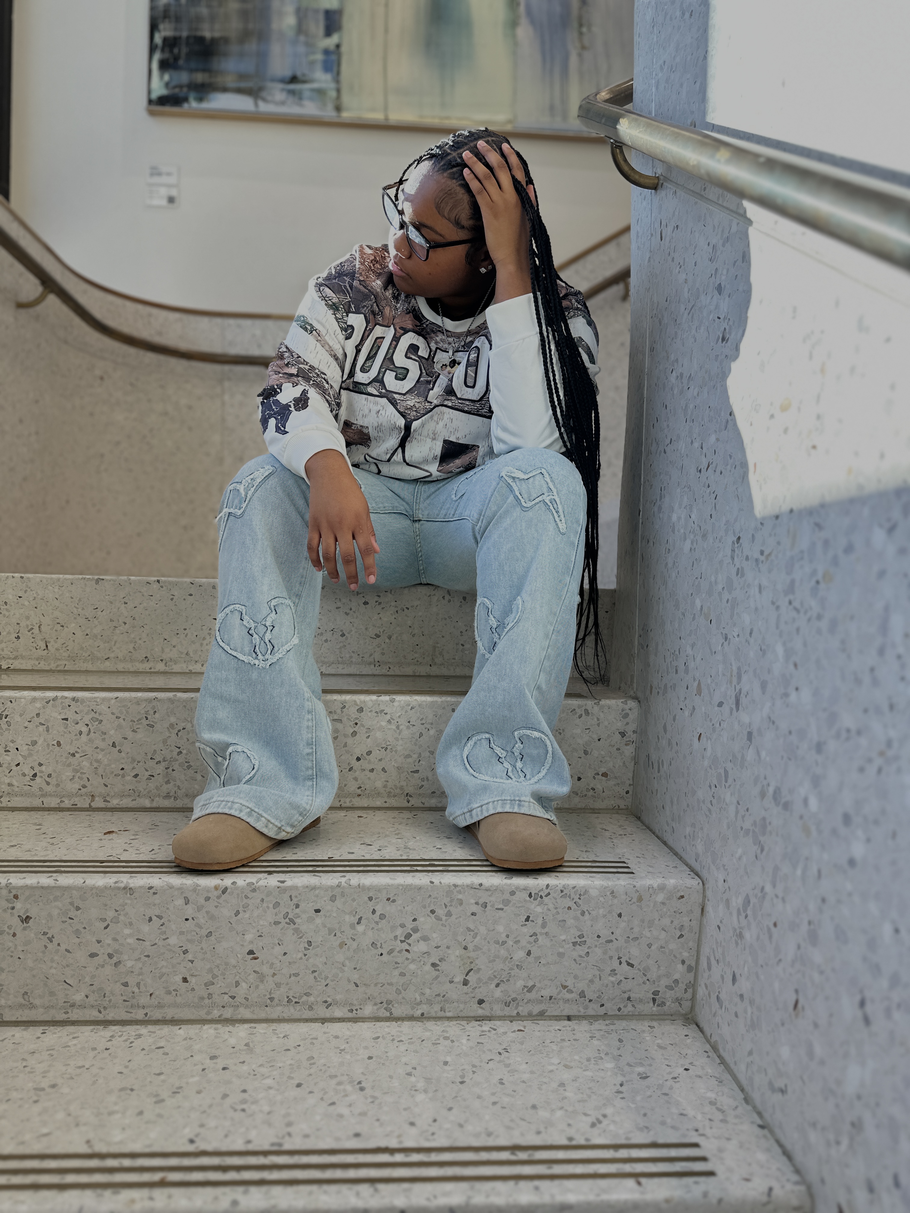 Angel sitting on steps