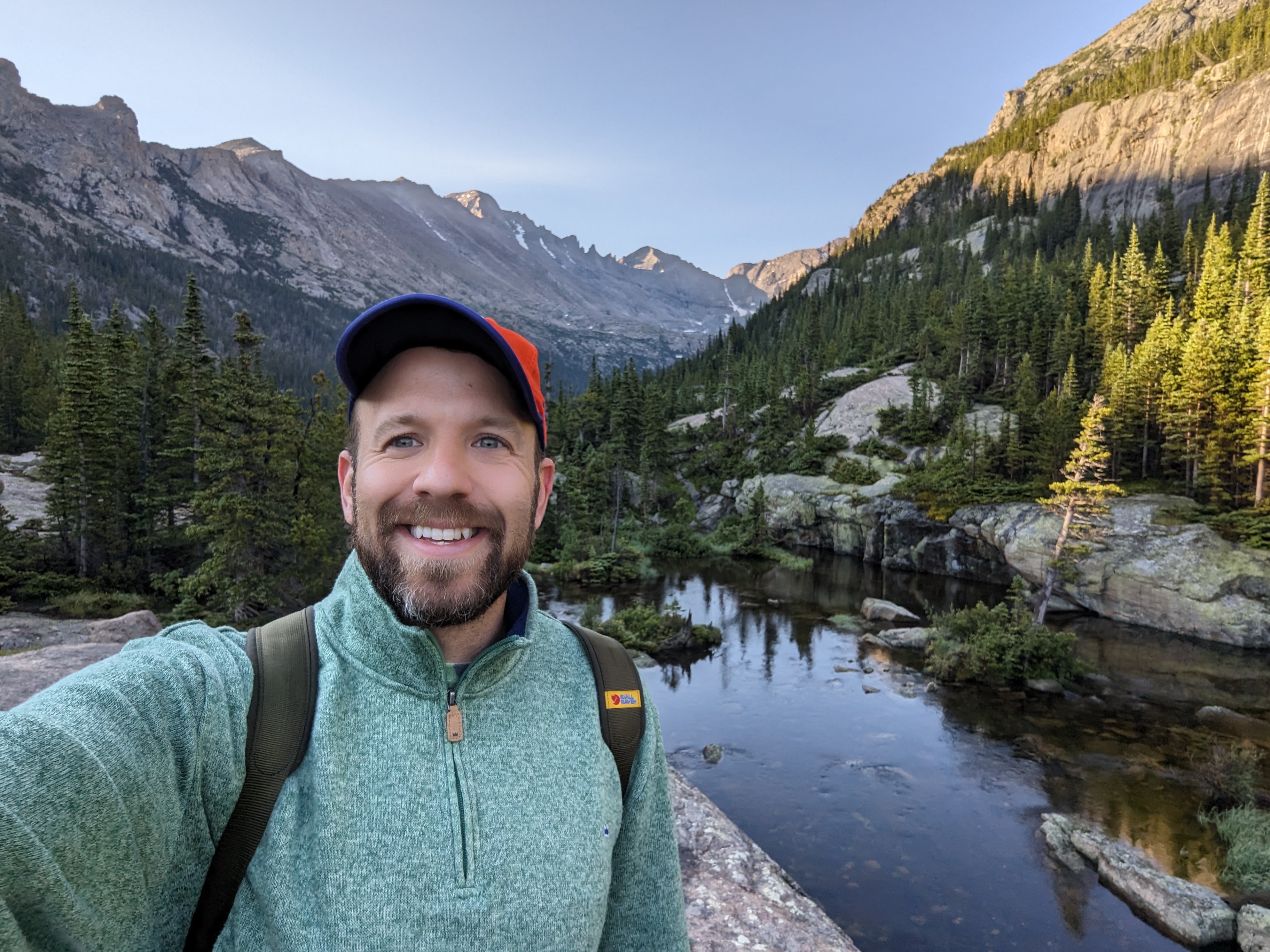 Matt in front of a mountain and river 