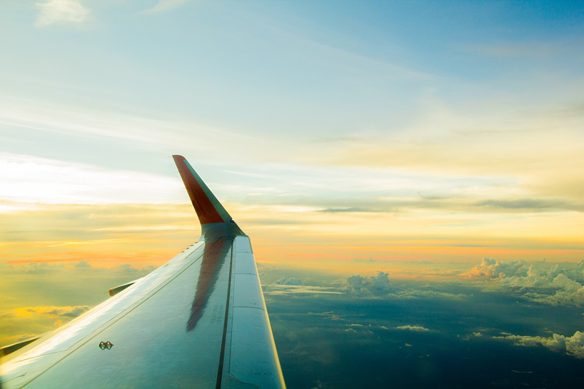 Photo of airplane wing in sky